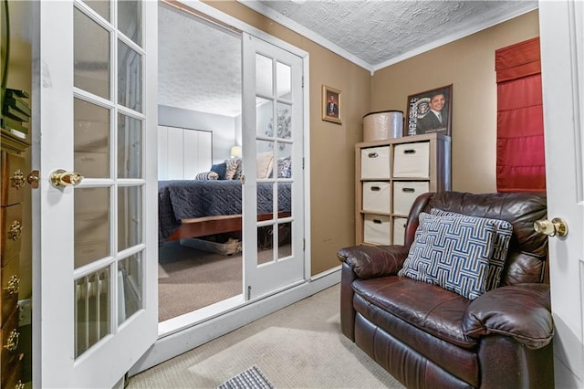 3778 Berdon Ln, Decatur, GA 30034 - living area featuring carpet flooring, ornamental molding, a textured ceiling, baseboards, and french doors