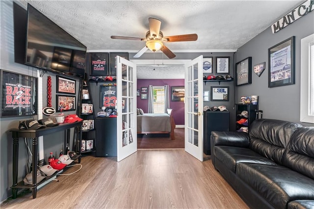 3778 Berdon Ln, Decatur, GA 30034 - living room with french doors, a ceiling fan, wood finished floors, and a textured ceiling