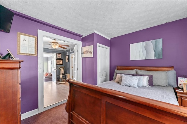 3778 Berdon Ln, Decatur, GA 30034 - bedroom featuring dark colored carpet, a textured ceiling, baseboards, and a closet