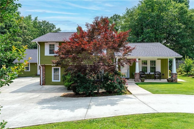 3778 Berdon Ln, Decatur, GA 30034 - view of front facade with a porch, a front yard, and a shingled roof