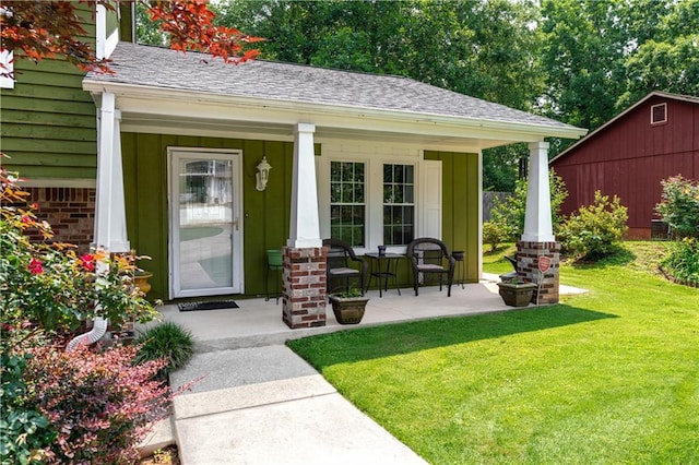3778 Berdon Ln, Decatur, GA 30034 - view of exterior entry with covered porch, a lawn, and roof with shingles