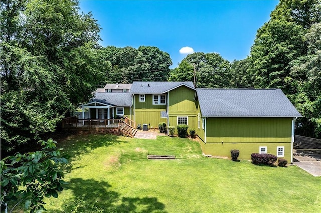 3778 Berdon Ln, Decatur, GA 30034 - rear view of house featuring a deck, roof with shingles, and a lawn