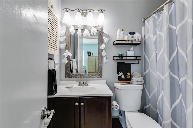 bathroom with vanity, a shower with curtain, and toilet