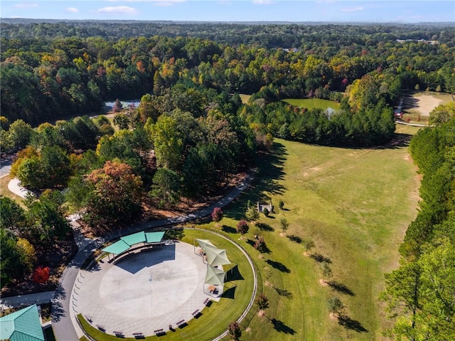 birds eye view of property with a wooded view