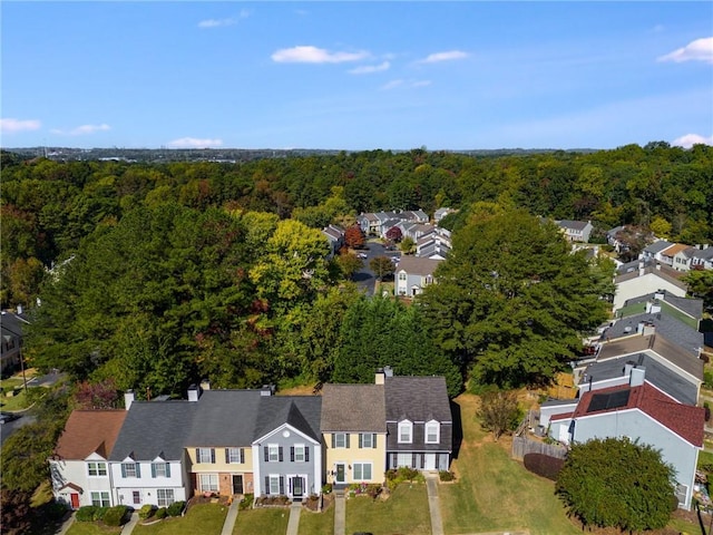 birds eye view of property with a residential view and a forest view