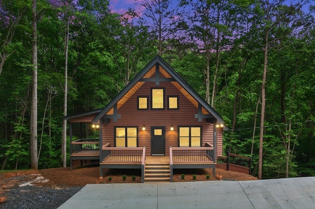 log-style house featuring a deck