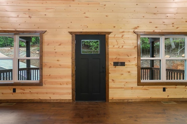 entryway with plenty of natural light and hardwood / wood-style flooring