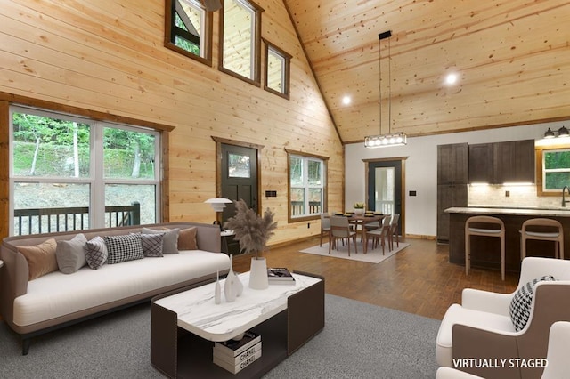 living room with high vaulted ceiling, a healthy amount of sunlight, dark wood-type flooring, and wood ceiling