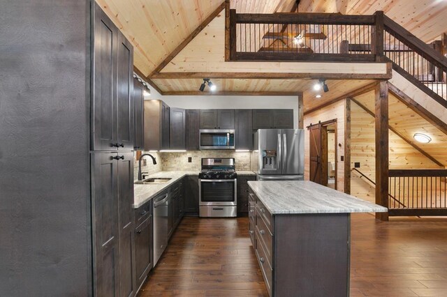 kitchen featuring dark wood-type flooring, stainless steel appliances, wooden ceiling, sink, and tasteful backsplash