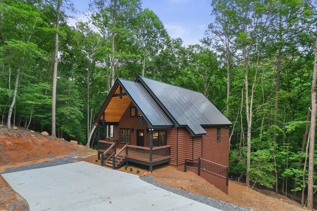 log-style house with a porch