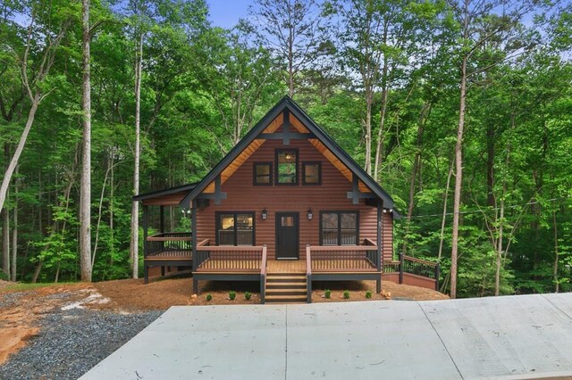 log home featuring a deck