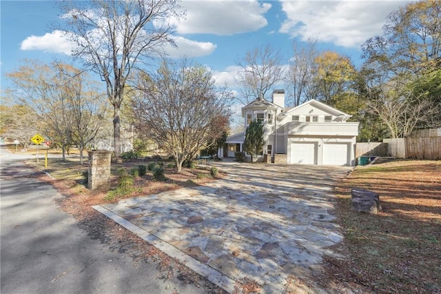 view of side of property with a garage