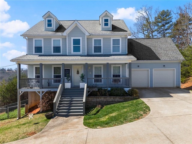 view of front of property with a shingled roof, fence, concrete driveway, covered porch, and a garage