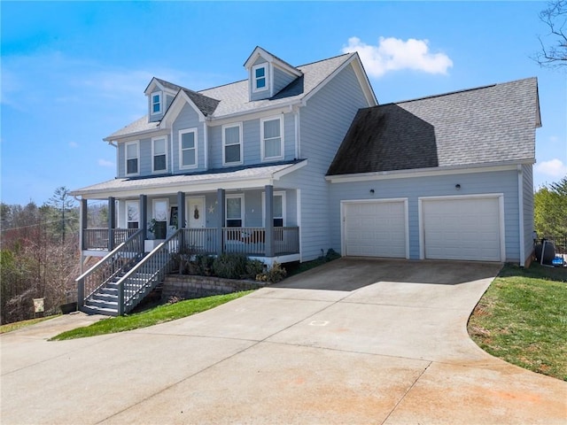 view of front of house with a porch, a garage, driveway, and roof with shingles