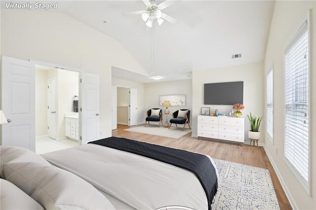 718 Surrey Park Pl SE, Smyrna, GA 30082 - bedroom with high vaulted ceiling, light hardwood / wood-style floors, and ensuite bath