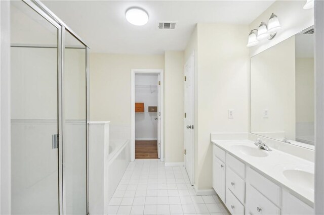 718 Surrey Park Pl SE, Smyrna, GA 30082 - bathroom with vanity, tile patterned floors, and shower with separate bathtub