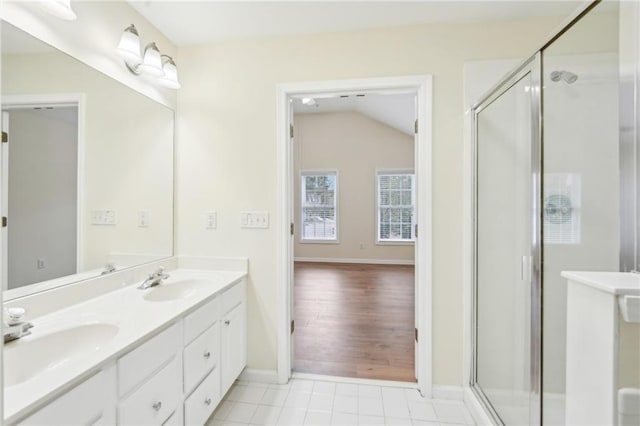 718 Surrey Park Pl SE, Smyrna, GA 30082 - bathroom with tile patterned flooring, vanity, a shower with shower door, and lofted ceiling