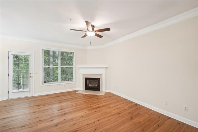 718 Surrey Park Pl SE, Smyrna, GA 30082 - unfurnished living room with crown molding, light hardwood / wood-style floors, and ceiling fan