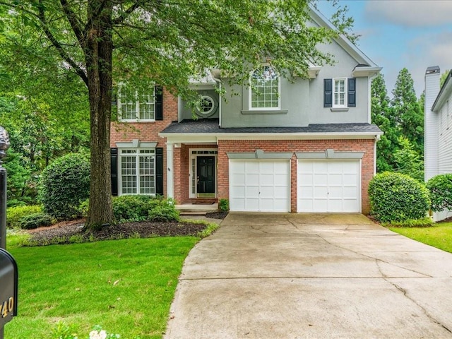 740 Orchard Ct, Atlanta, GA 30328 - view of front facade featuring a garage, stucco siding, a front lawn, concrete driveway, and brick siding