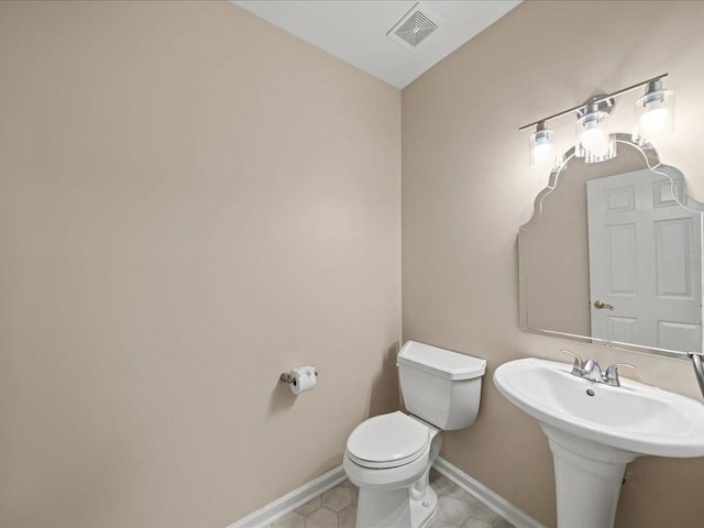 740 Orchard Ct, Atlanta, GA 30328 - half bath featuring toilet and tile patterned flooring