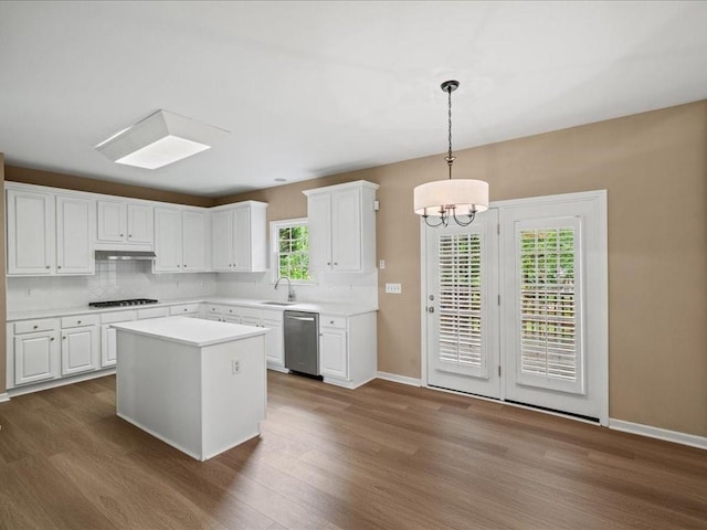 740 Orchard Ct, Atlanta, GA 30328 - kitchen featuring dishwasher, gas cooktop, dark wood-type flooring, and white cabinetry