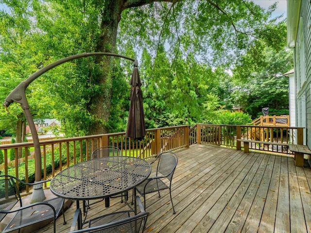 740 Orchard Ct, Atlanta, GA 30328 - deck with outdoor dining space and view of scattered trees