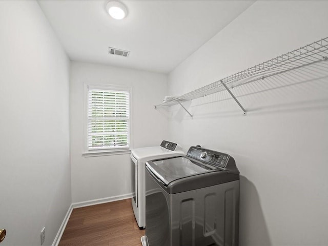 740 Orchard Ct, Atlanta, GA 30328 - laundry room featuring washing machine and clothes dryer and wood finished floors
