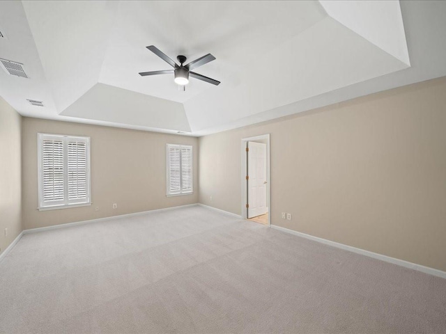 740 Orchard Ct, Atlanta, GA 30328 - empty room featuring a tray ceiling, a ceiling fan, and light colored carpet