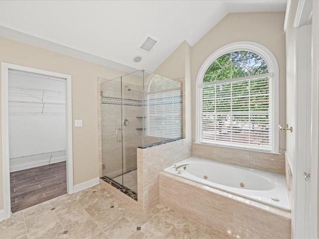 740 Orchard Ct, Atlanta, GA 30328 - full bath featuring a stall shower, a tub with jets, lofted ceiling, and a walk in closet