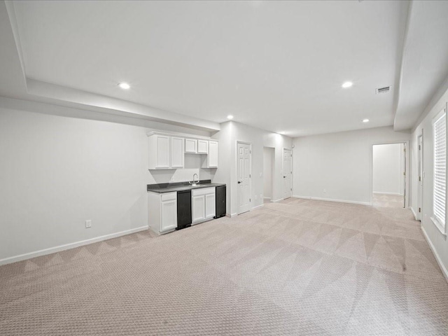 740 Orchard Ct, Atlanta, GA 30328 - unfurnished living room featuring light carpet, recessed lighting, and bar with sink