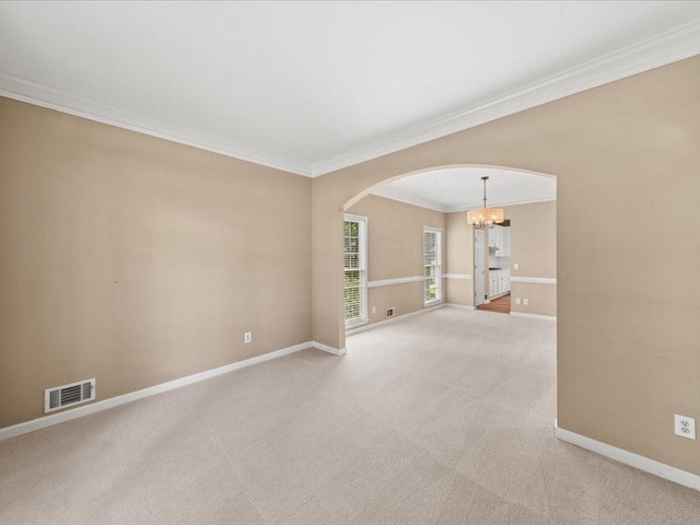 740 Orchard Ct, Atlanta, GA 30328 - empty room featuring arched walkways, a chandelier, ornamental molding, and light colored carpet