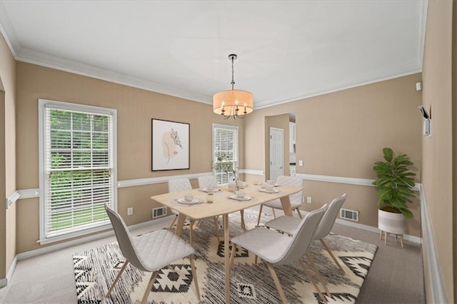 740 Orchard Ct, Atlanta, GA 30328 - carpeted dining space with crown molding and a chandelier
