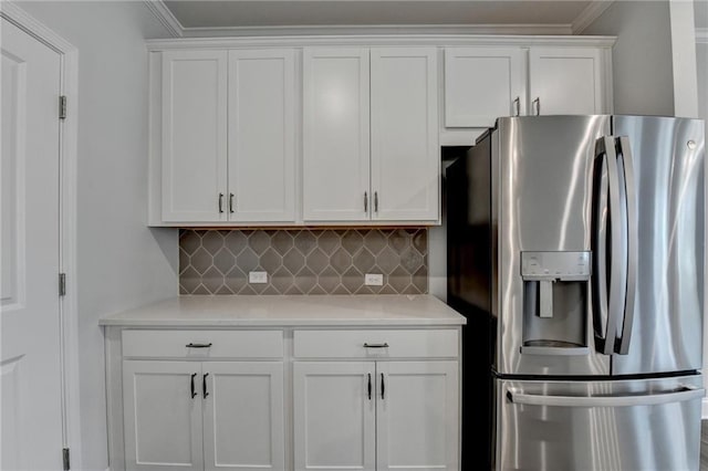 6270 Bracken Brown Dr, Alpharetta, GA 30004 - kitchen with stainless steel fridge with ice dispenser, light countertops, white cabinets, tasteful backsplash, and ornamental molding