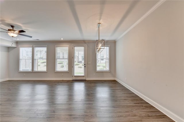 6270 Bracken Brown Dr, Alpharetta, GA 30004 - spare room featuring crown molding, plenty of natural light, dark wood finished floors, and ceiling fan