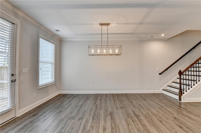 6270 Bracken Brown Dr, Alpharetta, GA 30004 - unfurnished dining area with stairway, wood finished floors, crown molding, and a chandelier