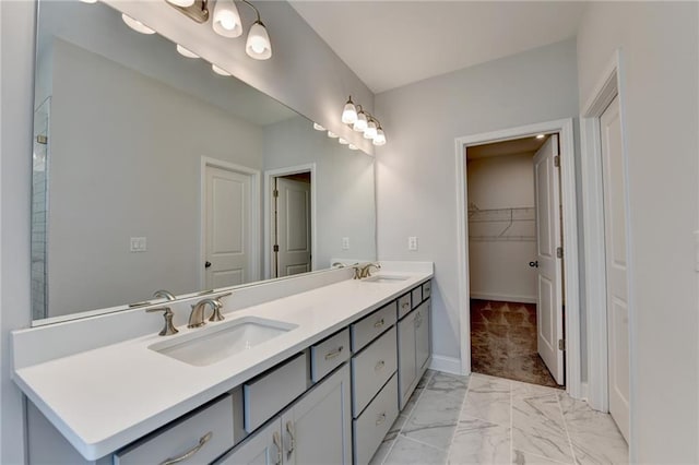 6270 Bracken Brown Dr, Alpharetta, GA 30004 - bathroom featuring double vanity, marble look tile flooring, and a spacious closet