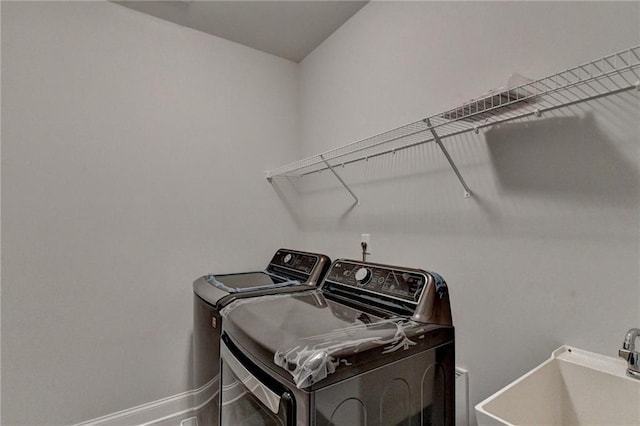 6270 Bracken Brown Dr, Alpharetta, GA 30004 - laundry room with washer and clothes dryer and baseboards