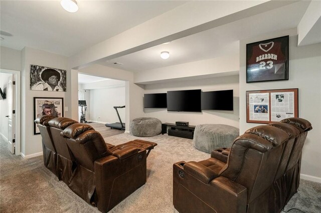 carpeted living room featuring baseboards