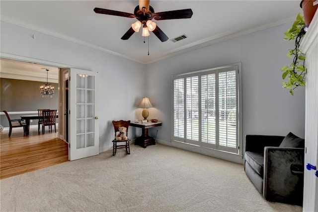 1901 Paper Birch Cv, Grayson, GA 30017 - living area featuring carpet floors, crown molding, a chandelier, ceiling fan, and baseboards