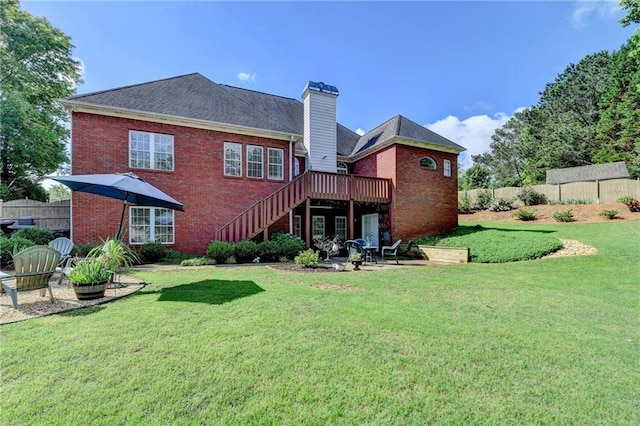 1901 Paper Birch Cv, Grayson, GA 30017 - rear view of house featuring stairs, brick siding, a chimney, a wooden deck, and a patio area