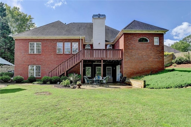 1901 Paper Birch Cv, Grayson, GA 30017 - back of property with brick siding, stairs, a deck, a patio, and a chimney