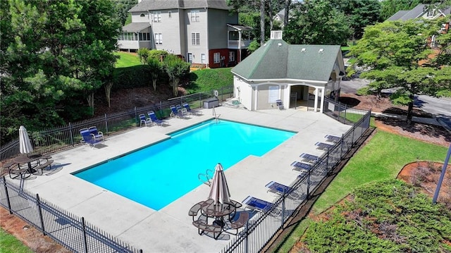 1901 Paper Birch Cv, Grayson, GA 30017 - community pool with a patio area and view of scattered trees