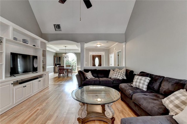 1901 Paper Birch Cv, Grayson, GA 30017 - living room with ornate columns, lofted ceiling, arched walkways, light wood-type flooring, and a ceiling fan