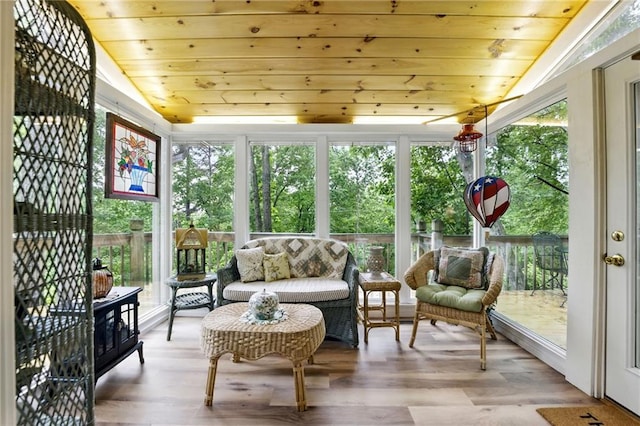 sunroom with outdoor lounge area and a wealth of natural light