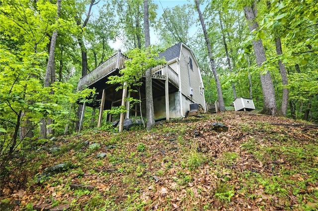 view of home's exterior featuring a wooden deck