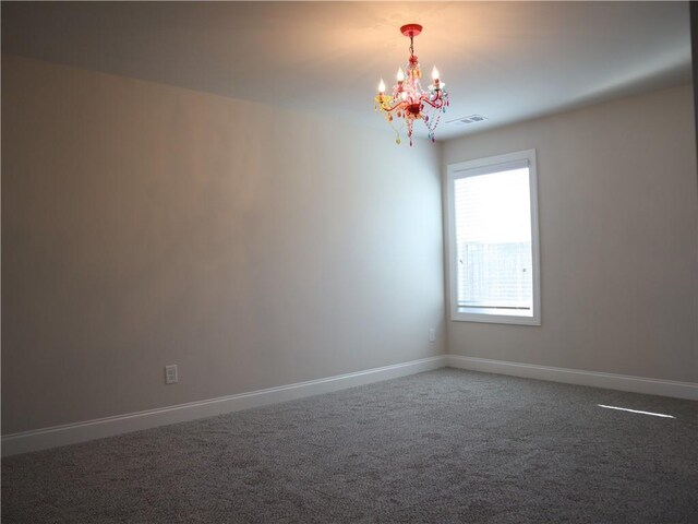 spacious closet with carpet floors, visible vents, and a ceiling fan