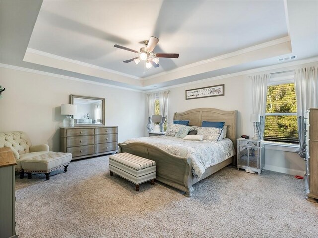 interior space featuring baseboards, visible vents, ceiling fan, and carpet flooring