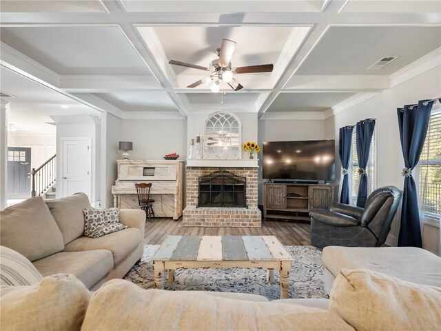 dining area featuring light wood finished floors, visible vents, stairway, crown molding, and a chandelier