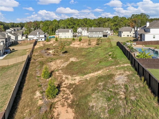 view of yard with fence and a residential view