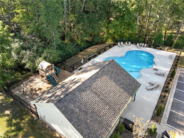 community pool featuring fence and a patio